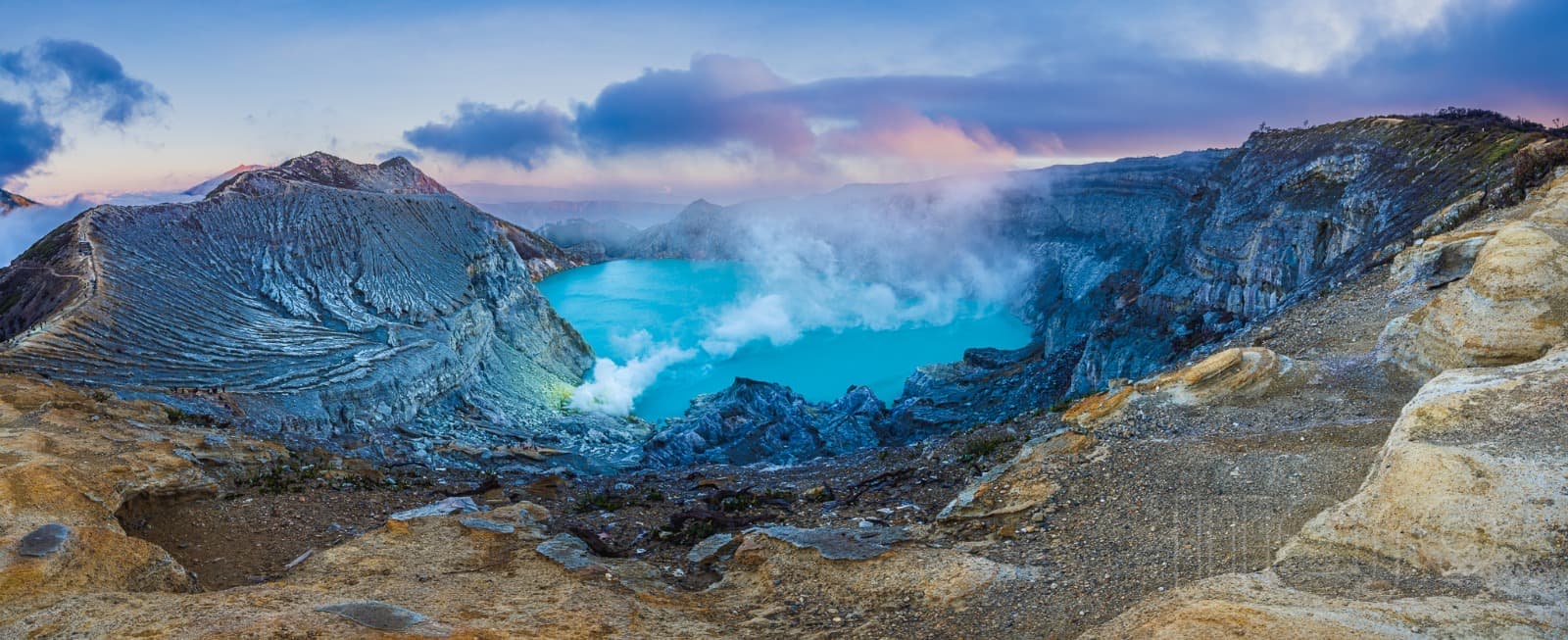 Ijen volcano crater sunrise across the strait from Pemuteran